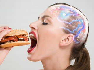 Woman eating hamburger