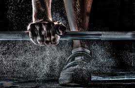 Person with hand on weight bar - The Benefits of Personalizing Your Gym Program blog post