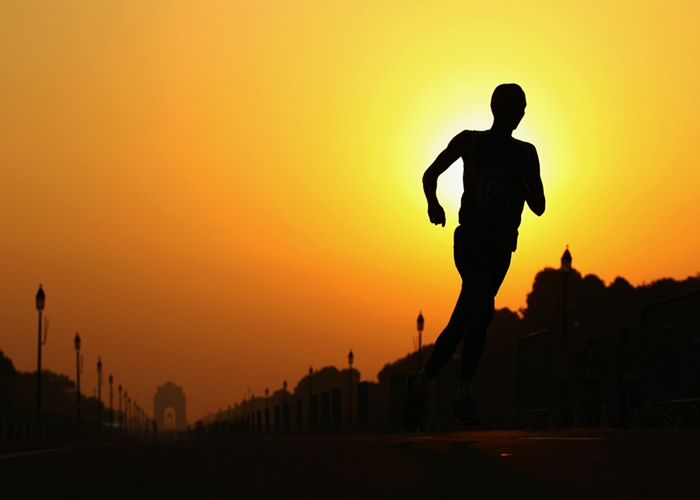 Silhouette of man jogging outside - Exercise for your body and mind blog post